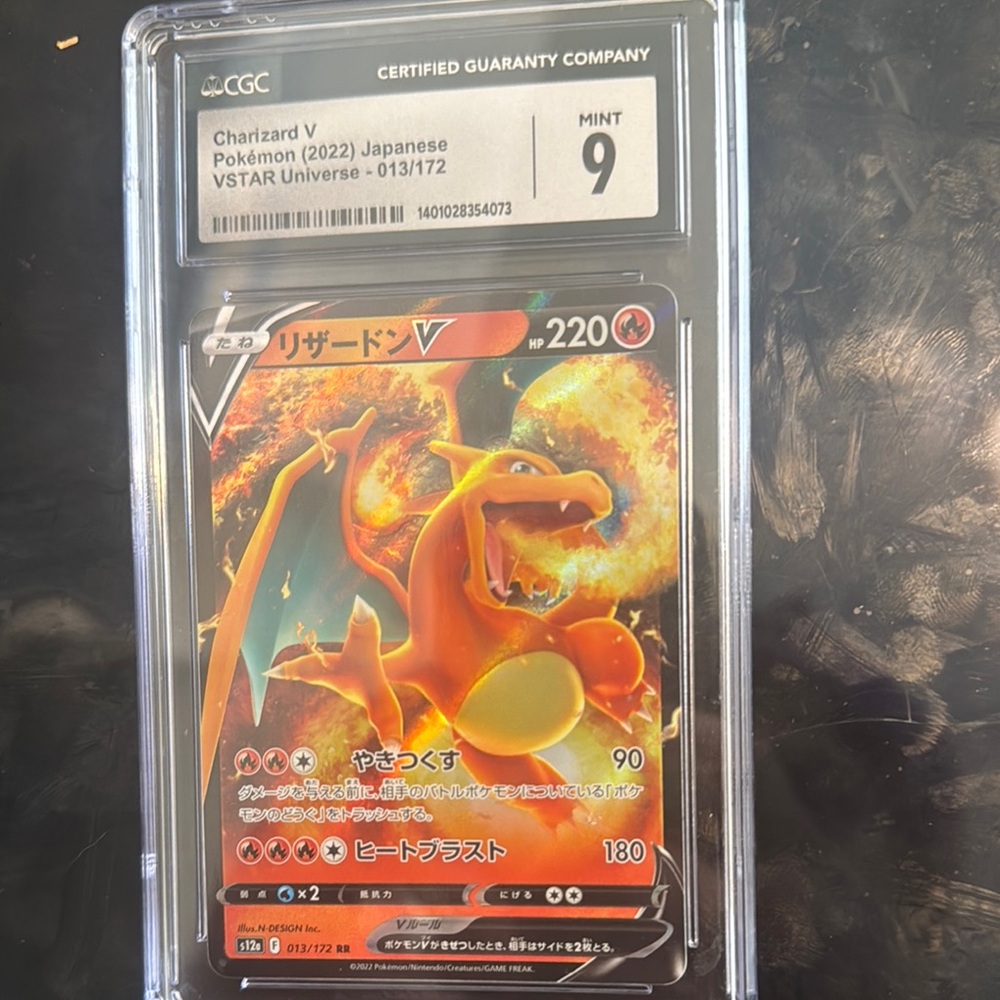 CGC Graded Charizard V Pokémon Card - Orange and Black